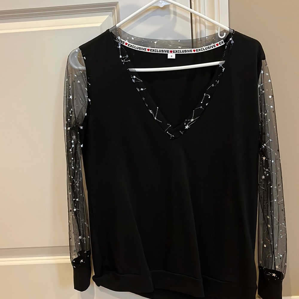 Two cute black and silver tops.